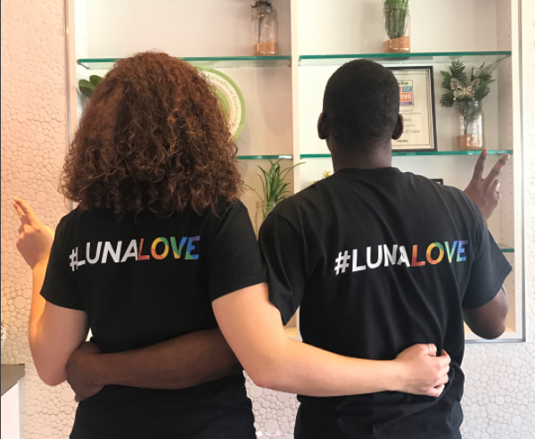 Two people wearing #LunaLove tshirts